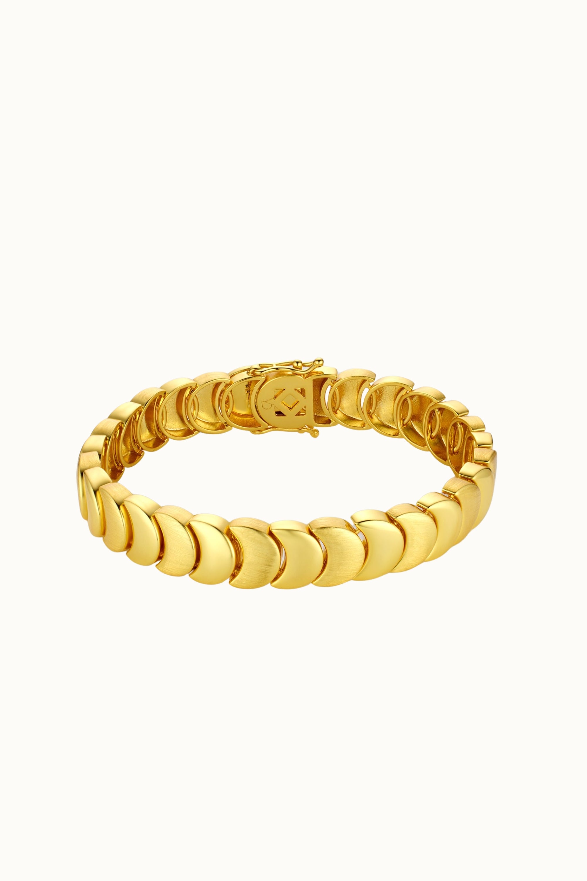 A gold-toned metal link bracelet with a textured, scalloped circular design and a small engraved logo on the clasp, shown against a plain off-white background.
